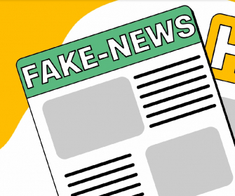 Es ist eine Zeitung mit der Überschrift Fake-News sichtbar. 